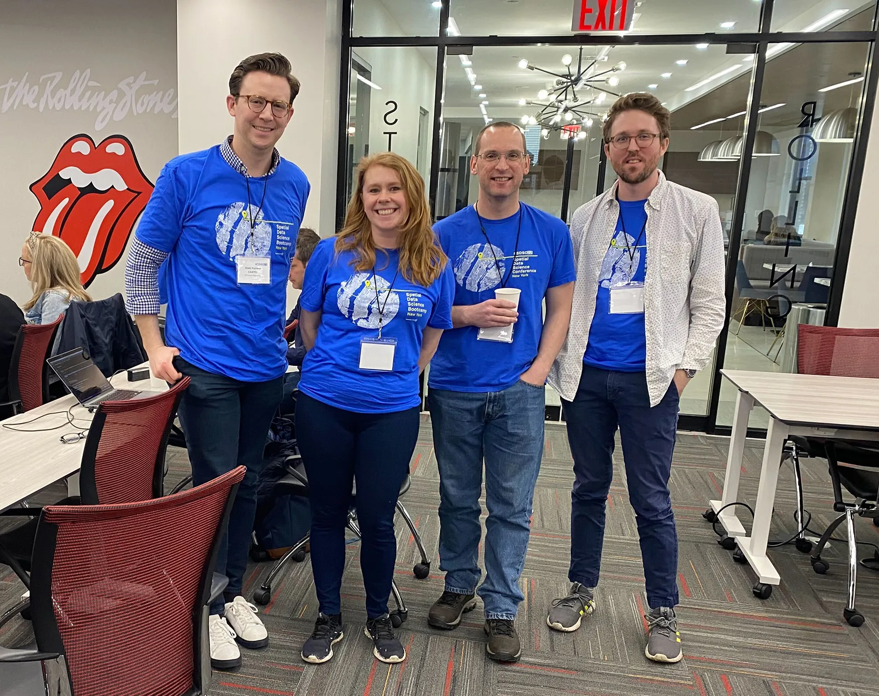 Group photo of the facilitators team, smiling and wearing the bootcamp t-shirts