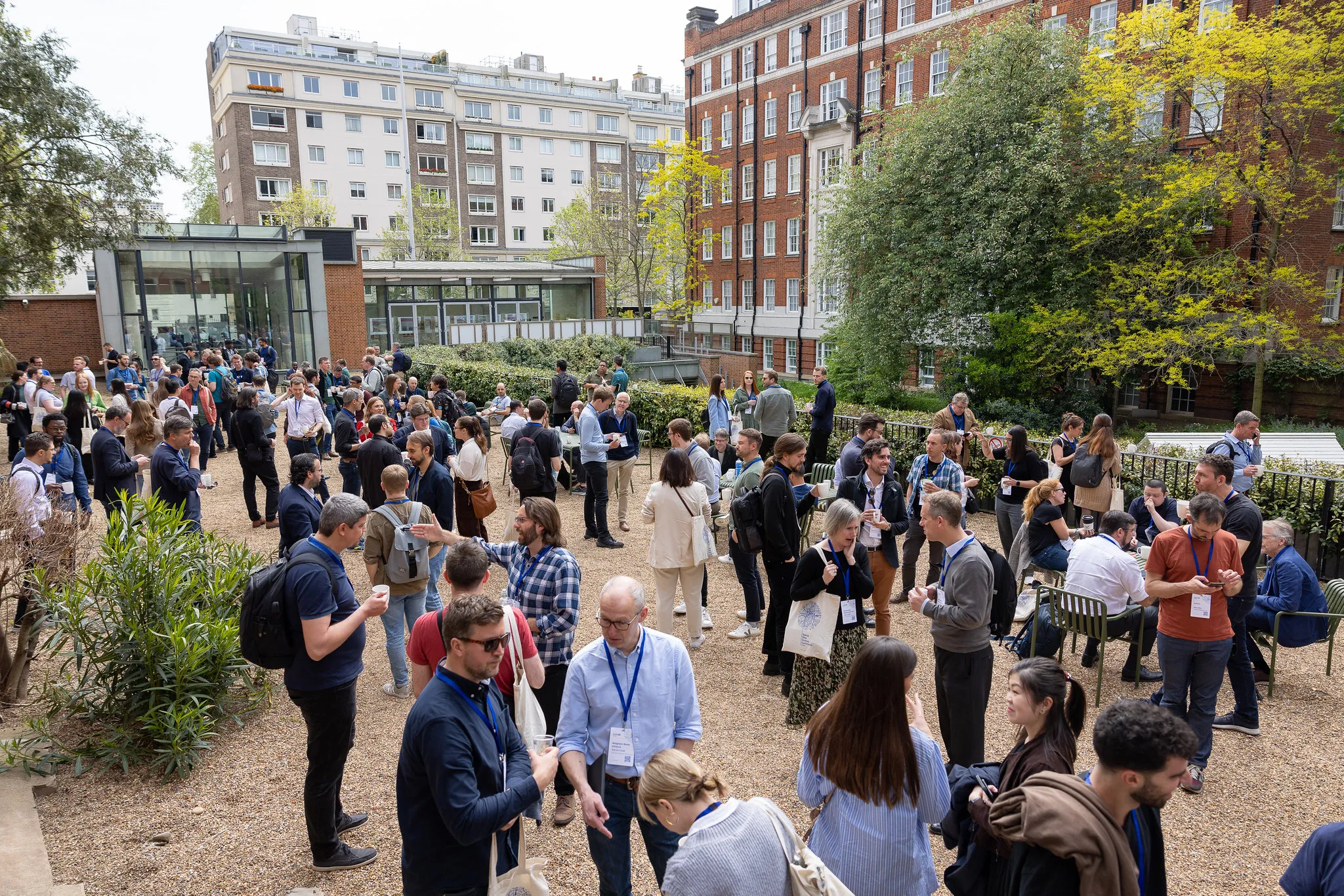 People networking on the terrace at SDSC at The Royal Geographical Society. 
