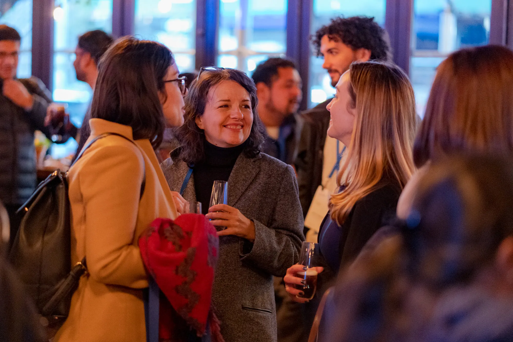 People smiling and enjoying the SDSC afterparty