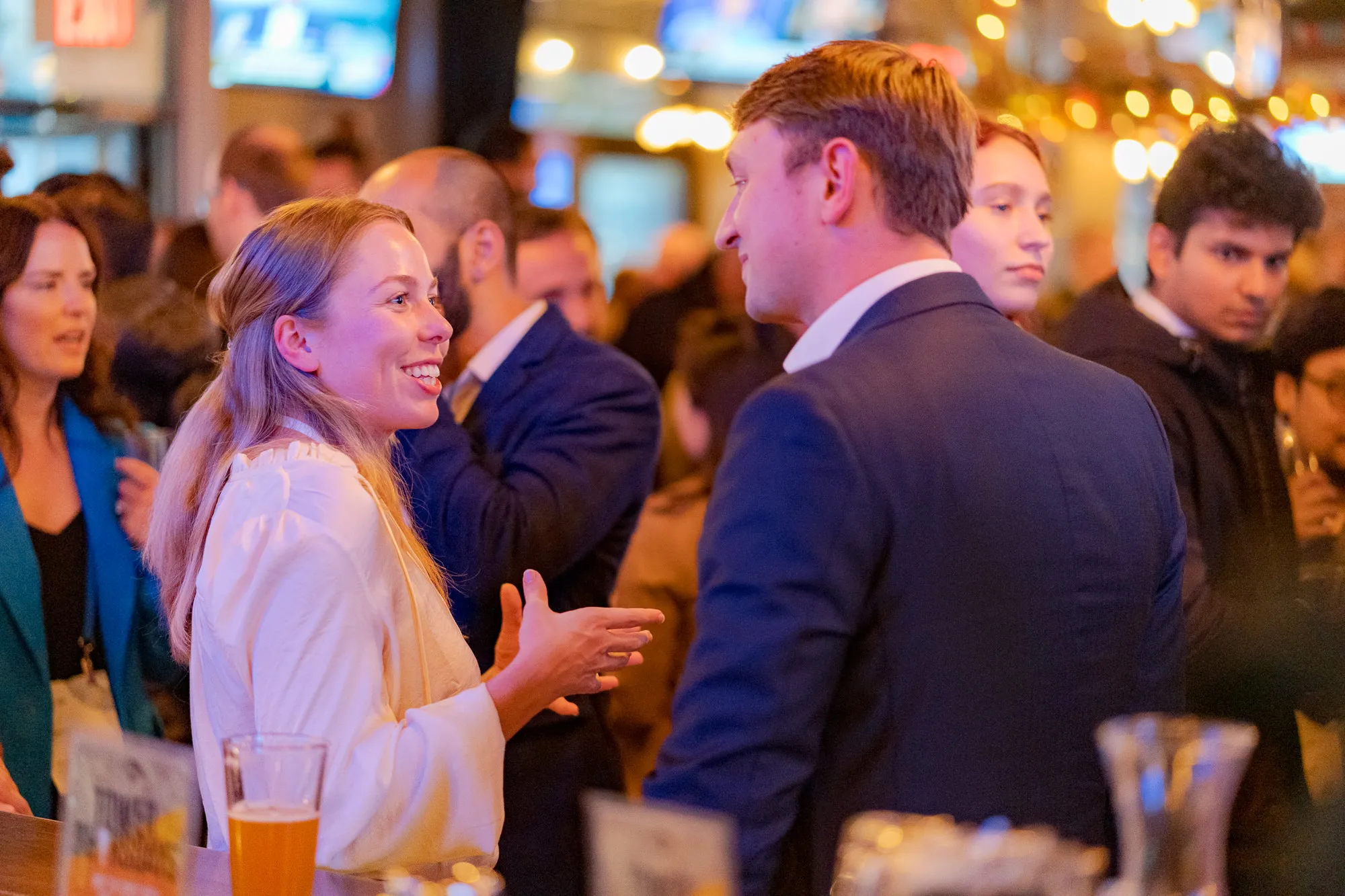 Two persons talking and smiling in the SDSC afterparty